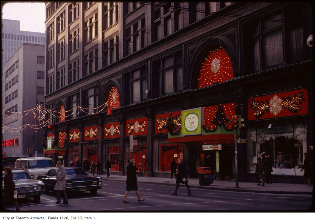 View of front of Simpson's with holiday decorations, Yonge and Queen Street West