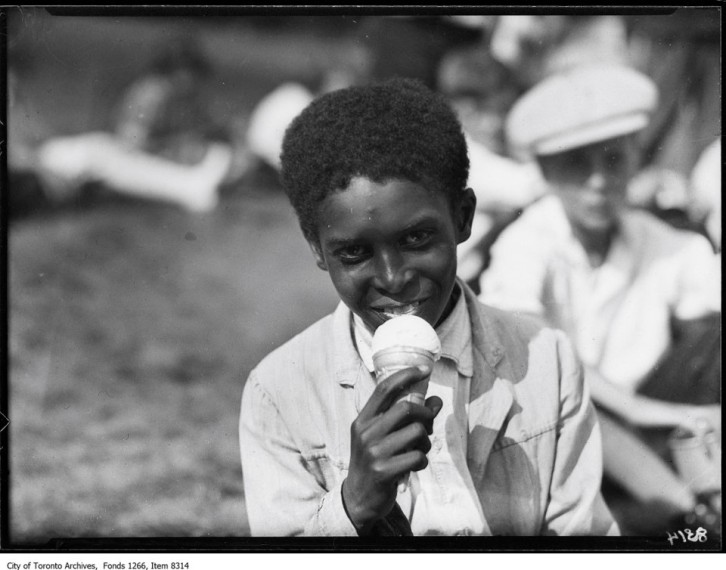 Boy eating ice cream Victoria Park School, July 21, 1926